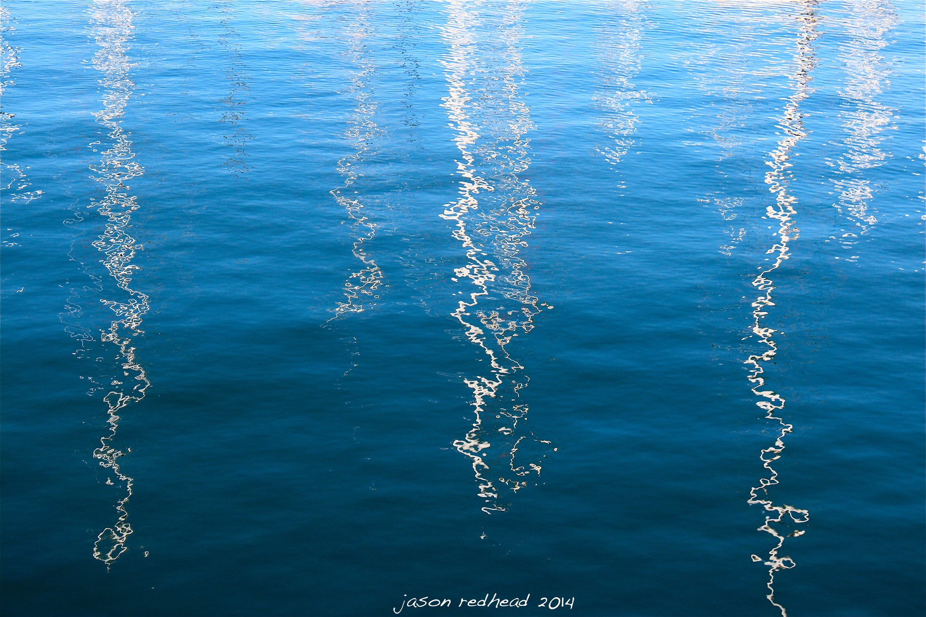  19-11-14 it doesn't really matter if you're black or white...or blue; what am i? ropes under the water, the suns reflections, cars headlights reflecting on the water or sail boat reflections, gladesville bridge marina, nsw