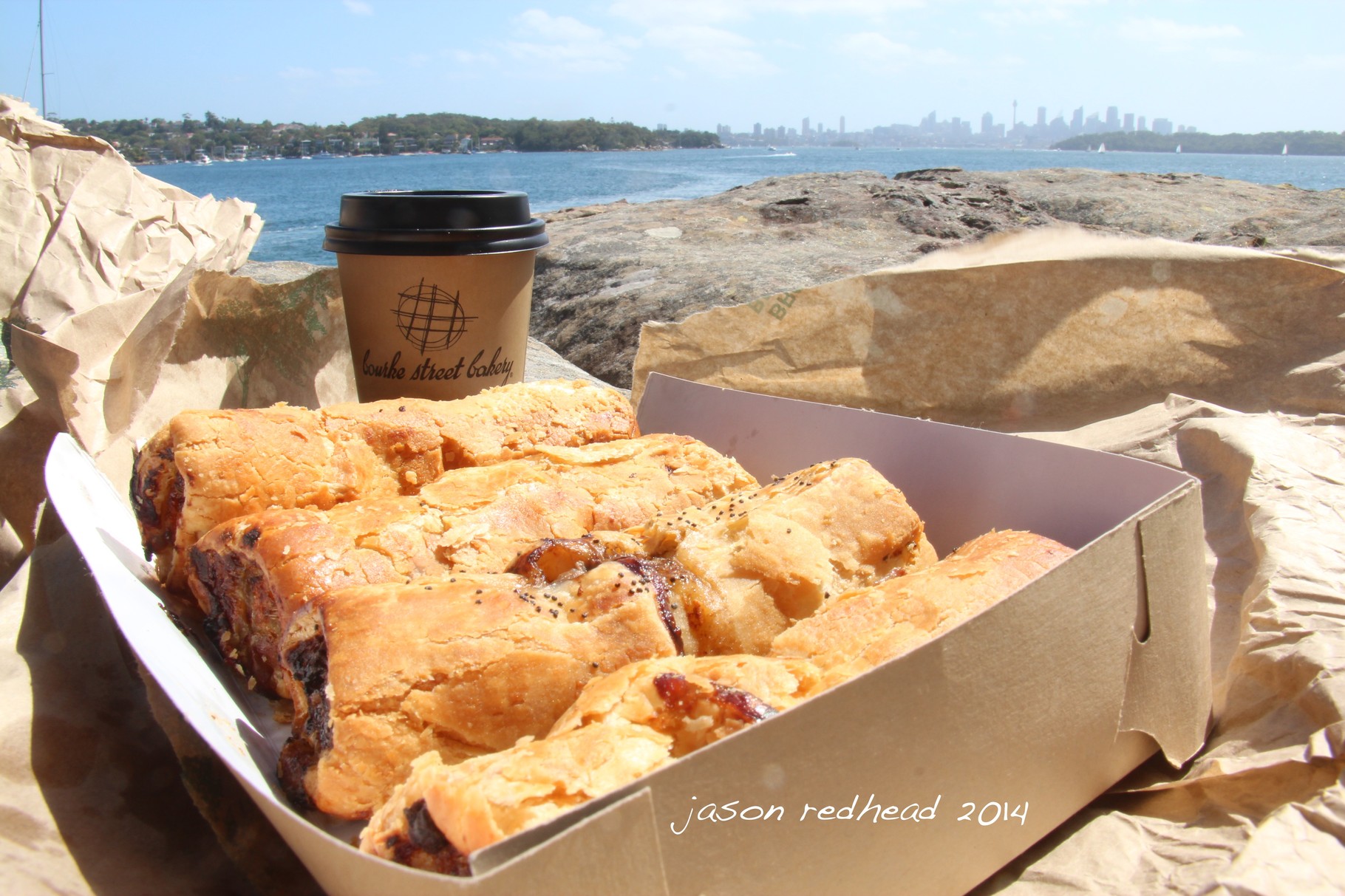  05-01-14 for mum; delicious bourke street bakery pork and fennel sausage rolls. unfortunately there was no sun left at bourke street to enjoy so found this spot instead. brilliant way to spend saturday afternoon, camp cove, nsw 