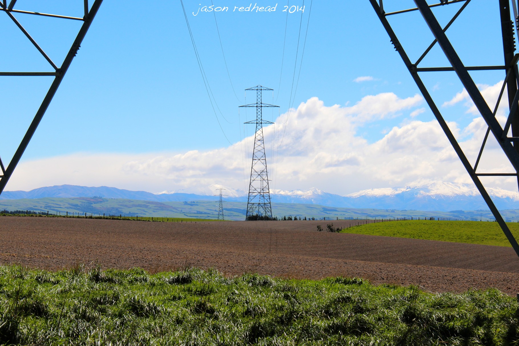 05-03-14 global warming at its finest; i think the peak to the right of the first pylon is fox peak. almost enough snow to go skiing! levels valley, nz 