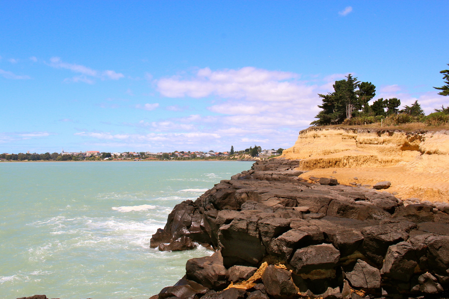 28-01-14 a dashing caroline bay; a not so early walk this morning took us to dashing rocks via the coastal track. beautiful teal green sea and a view back towards timaru town centre, dashing rocks, timaru, nz