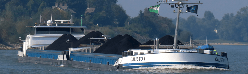 Cargo ship Calisto I loaded with coal sailing on the Rhine, an example of European inland shipping vessels