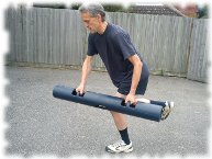 Back pain clinic and massage therapist, teaching corrective exercise for rehab and coordination