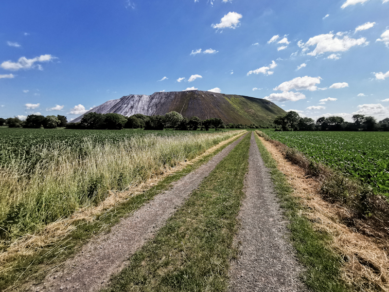 Interesting artificial hill ahead. Massive landfill of some sorts I guess. 