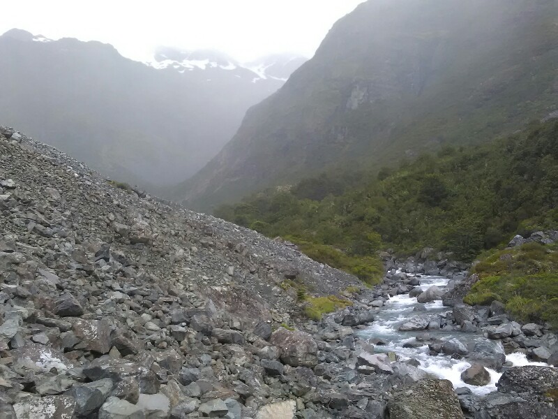 Annoying rock field. Waiau Pass now covered in clouds