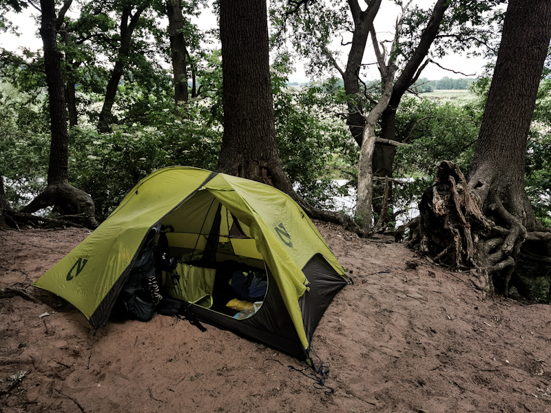 Sandy camp overlooking the river