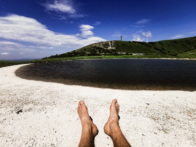 As close to a beach it gets. The white thing is not sand but concrete, the lake a water source for cows. 