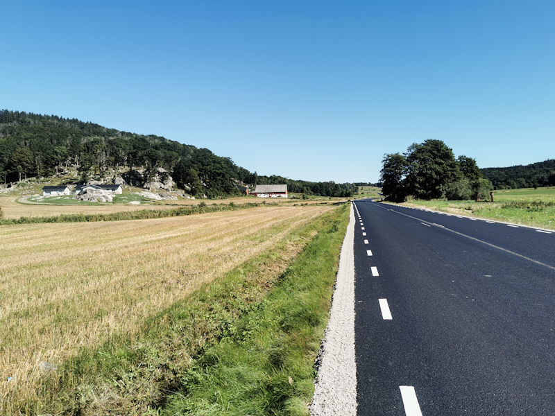Brand new road through farmland.