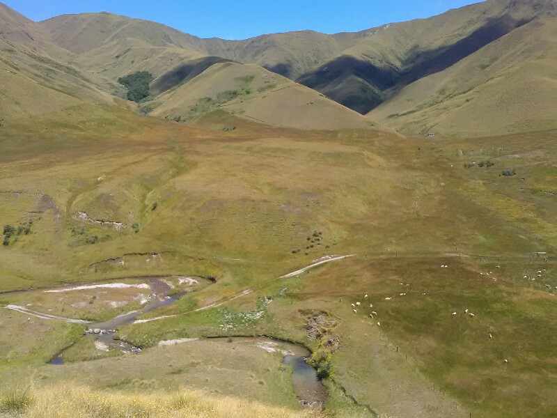 Descending to Roses Hut, visible on the right