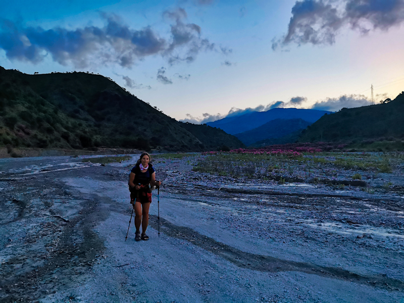 Maria following the river bed of Torrente Zavianni 