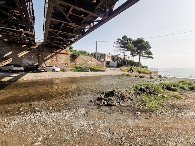 Urban hiking. River crossing under the railway bridge.