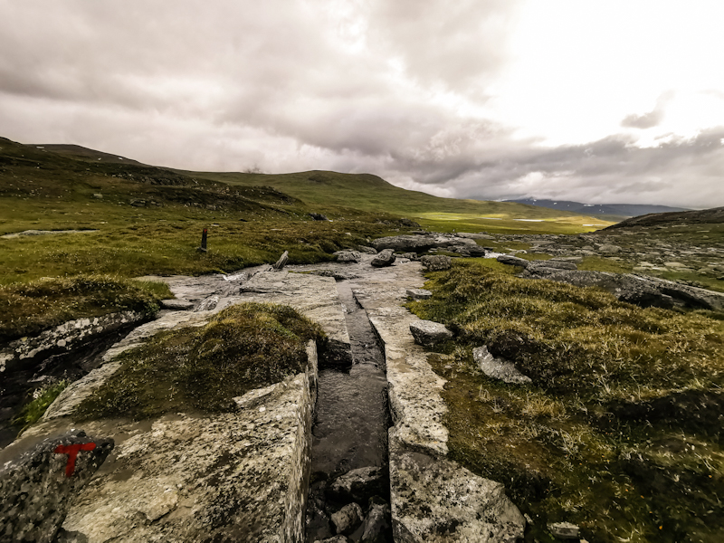 A look back. The river flowing through a crack in the rock. 