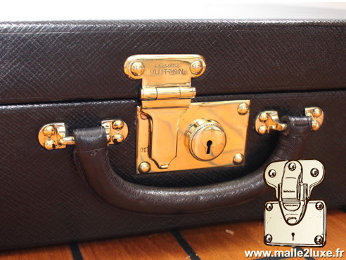 Louis Vuitton steel suitcase push lock