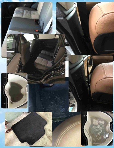 車内シートに嘔吐物が付着し、繊維の奥まで汚れと臭いが染み込んでいる様子。