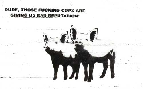 Anarchist-style graffiti with two pigs talking with words 'Dude those cops are are giving us a bad reputation'