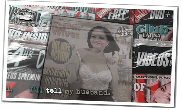 Newsagent's shelf with magazines in plastic covers. 