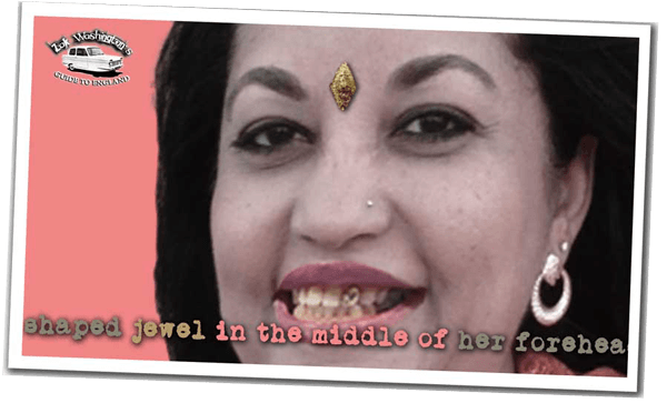 Polaroid of an Indian woman with a jewel in her forehead and a gold tooth. 