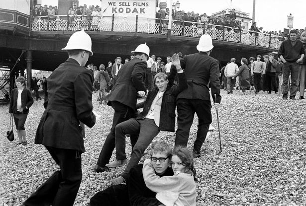 British culture photo: Mod being arrested on the beach in 1964