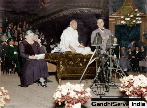 25 - Mahatma Gandhi addressing a meeting of International Workers and Labourers at People's Hall in Lausanne, Switzerland, December 8, 1931. Right: Edmond Privat.