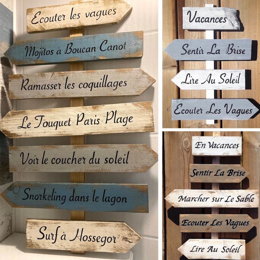 Collage de panneaux de direction en bois avec citations poétique ou romantique peinte à la main
