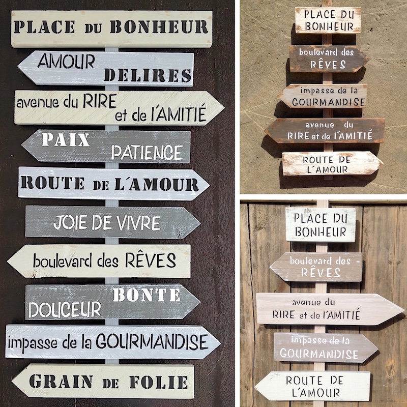 Montage de panneaux bois à personnaliser pour réception, flèches directionnelles peintes, messages peints en noir et blanc