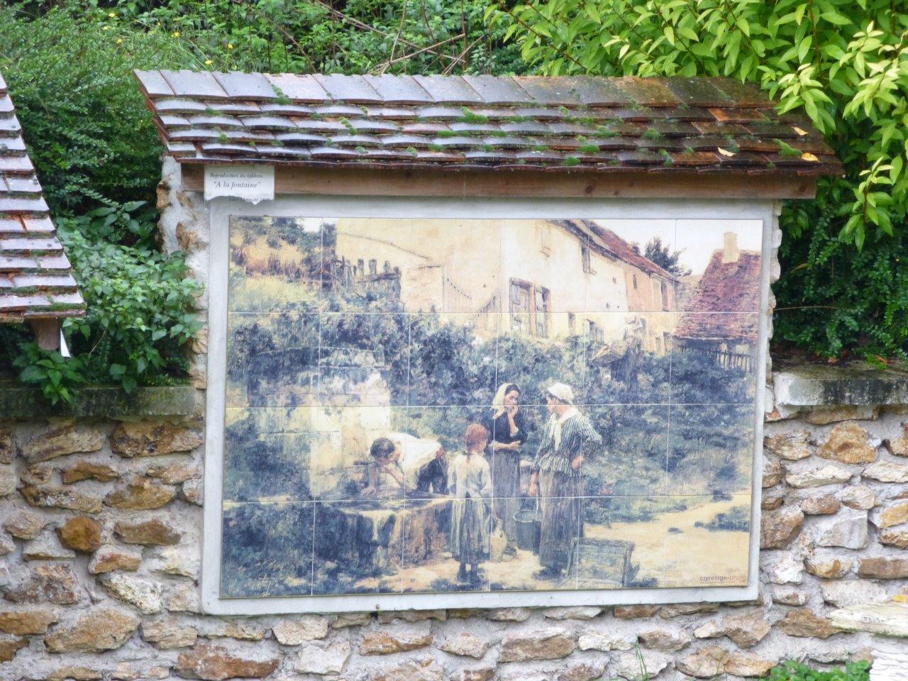 À Mont-Saint-Père, une fresque céramique reproduisant le tableau "À la fontaine" peint, ici, par Léon Lhermitte en 1895, embellit la restauration du lavoir.