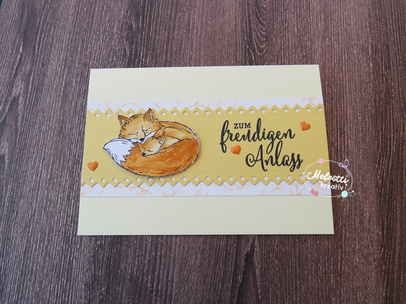 Eine Babykarte in Gelb-Orange