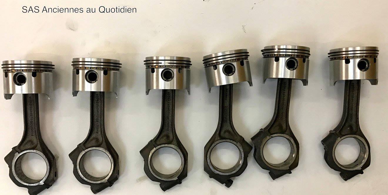 Réfection du moteur : mise en place des pistons et segments côte réparation