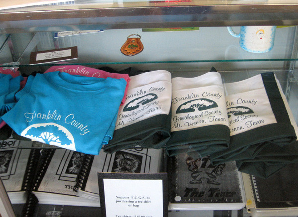 T-shirts and other merchandise available in the Society Research Room