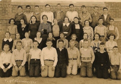 Mt Vernon School, 1934, Franklin County, Texas. Submitted by John Scott. IDs:  Allie Christine Hester, 3rd row up, 5th person from right to left, with large white collar and belt.