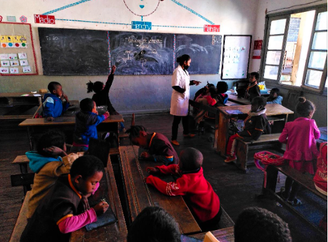 Antananarivo. Primary school children learning mental arithmetic with a teacher trained by KOZAMA.