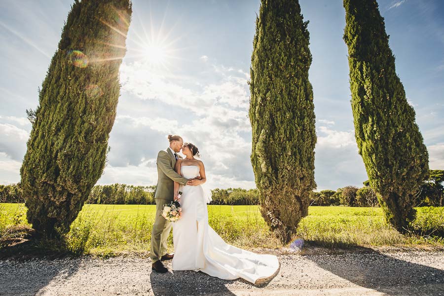 Two brides portrait in Tuscany with historic architecture and soft natural tones