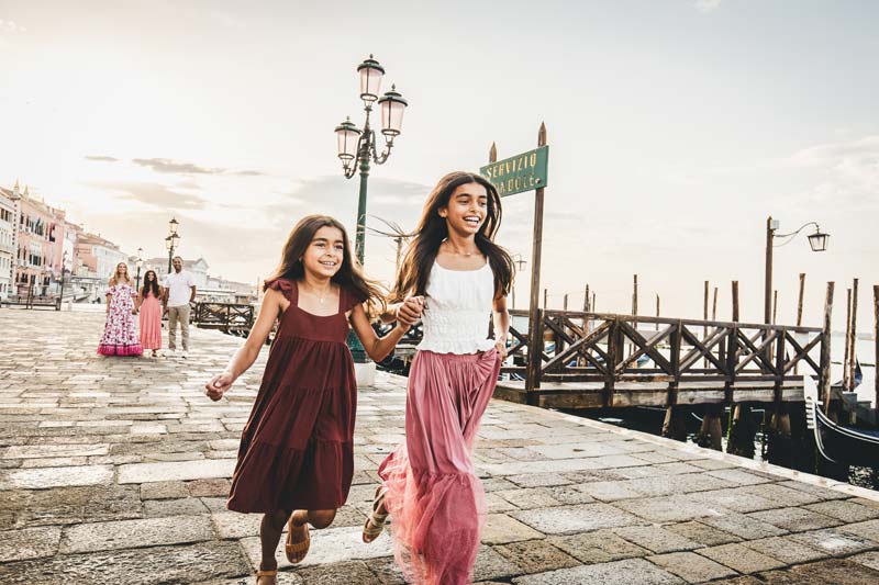 Natural family moment captured near Piazza San Marco at sunrise