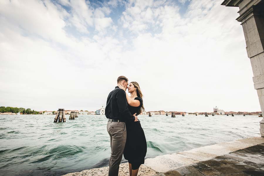 Venice’s iconic architecture with a couple at sunset