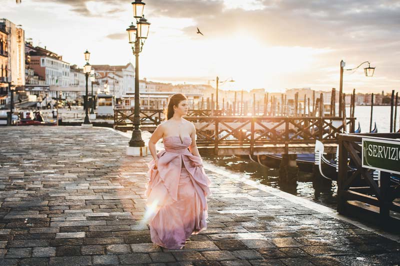Quinceañera portrait in Venice with pastel gown near the Grand Canal at sunrise