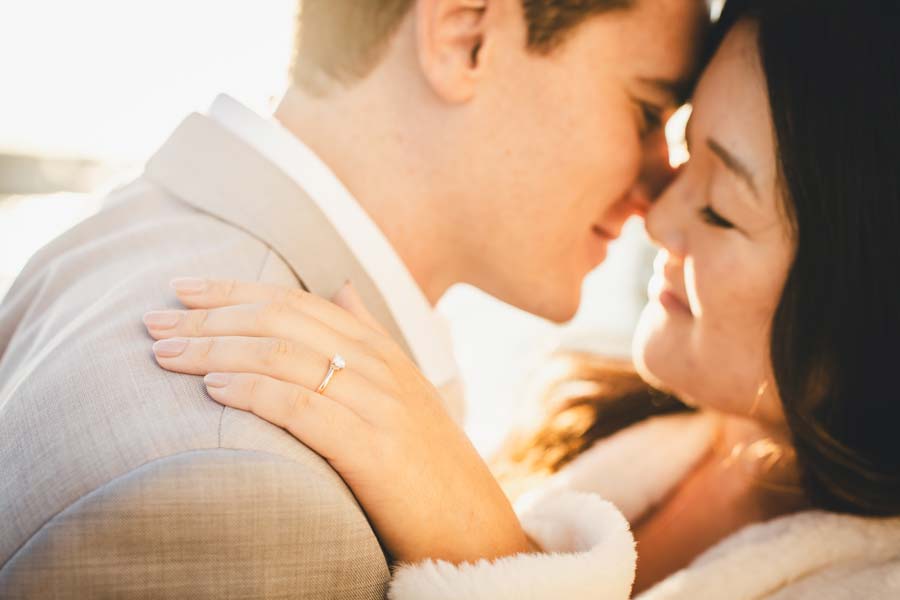 couple laughing during engagement in Venice hidden alley