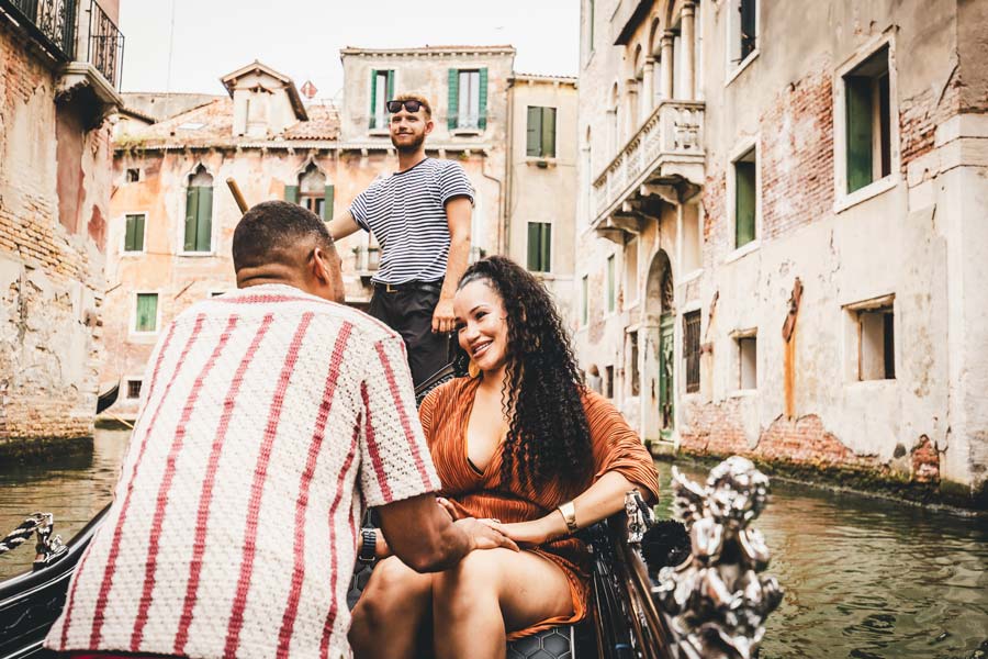 Venice proposal scene with gondola and historic architecture in the background