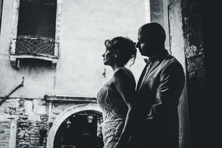 Couple posing alone in a quiet area near the hotel