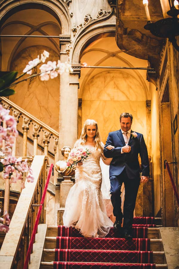 Bride descending the marble staircase 