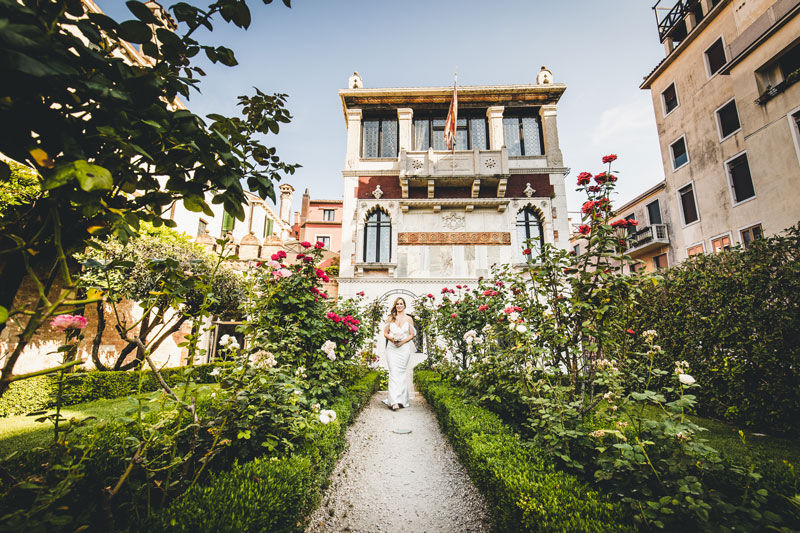 A tender moment as the couple shares their first kiss as newlyweds, captured beautifully by a venice elopement photographer.