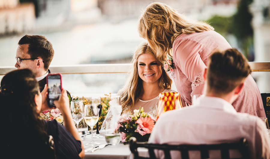 Elegant table setting with floral arrangements at the wedding reception.