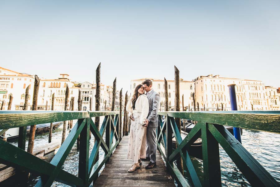 couple enjoying Venice during engagement session near historic buildings