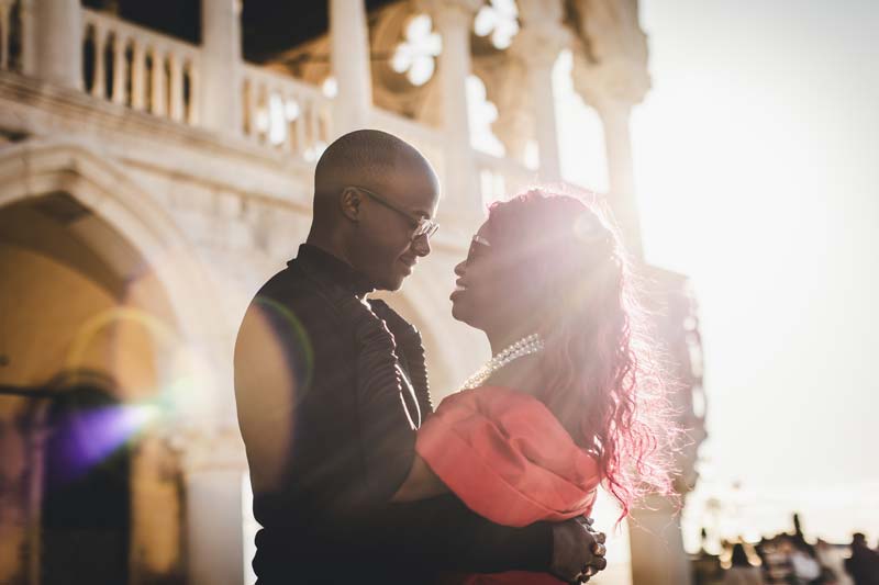 A candid photo of a couple enjoying gelato while exploring the city during their anniversary trip.