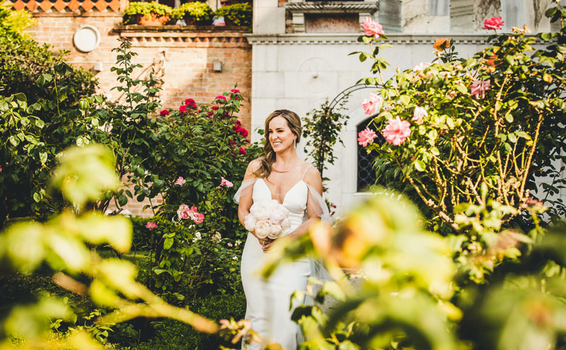 The first look, with the groom seeing his bride for the first time in the hotel's peaceful courtyard.