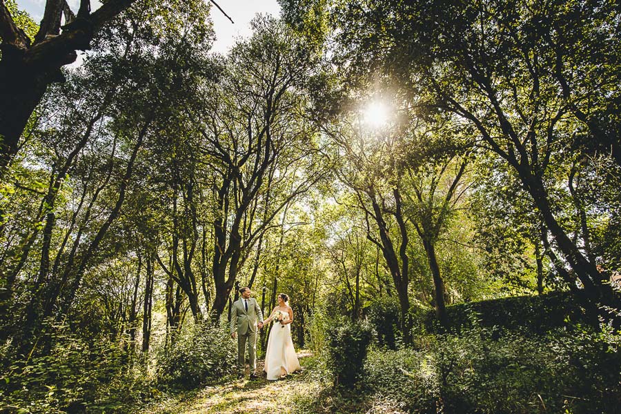 Double wedding dinner setup in Tuscany with long tables and warm atmosphere