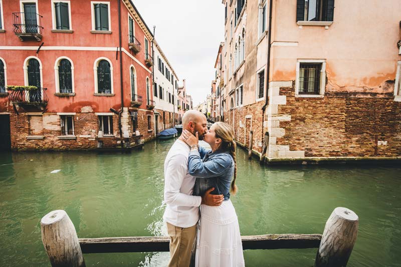 Tender embrace by the canal following the proposal