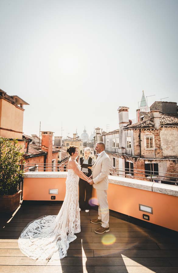 Intimate vow exchange during elopement at Hotel Splendid