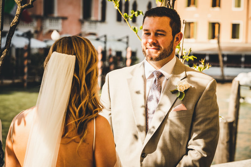 A couple shares an intimate moment in a lavish suite at the Ca' Nigra Hotel in Venice.