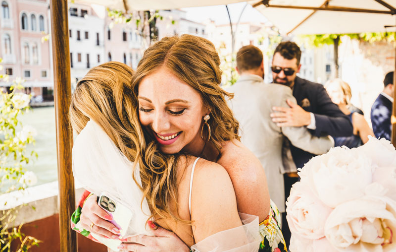 The couple's joyful exit from the hotel, ready to explore the city as newlyweds.