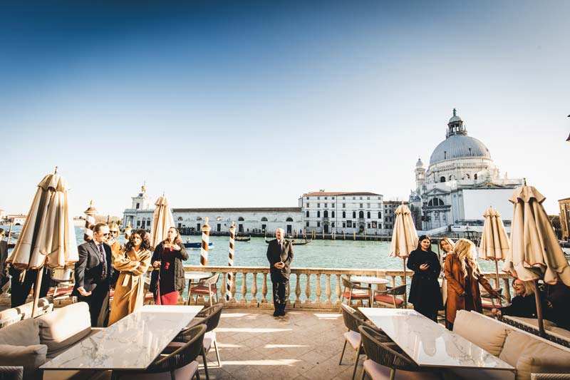 Elopement ceremony with gondolas passing on the Grand Canal