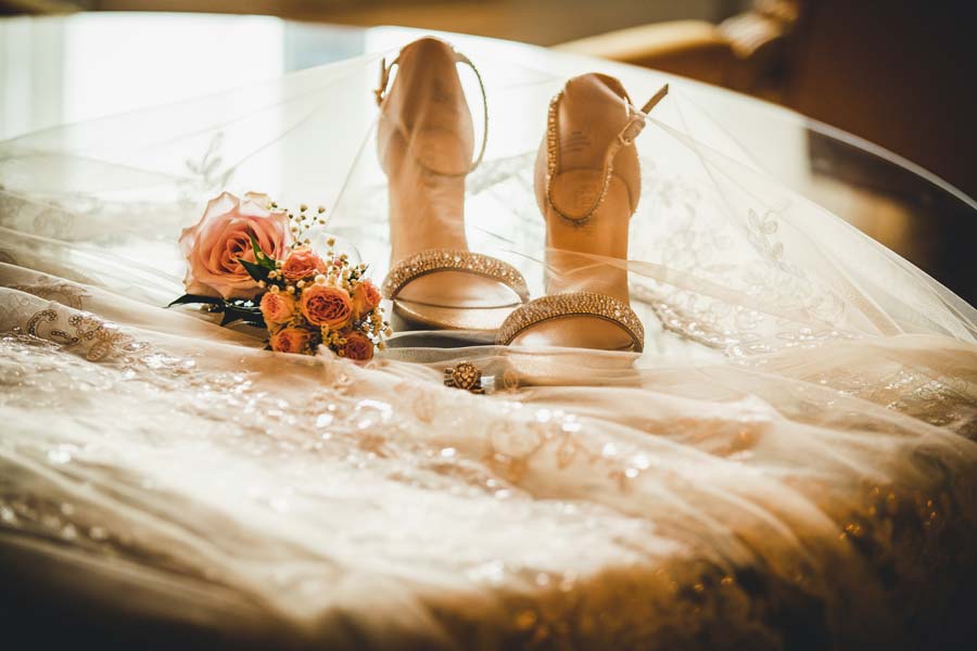 Wedding rings placed on a velvet cushion with Venetian decor